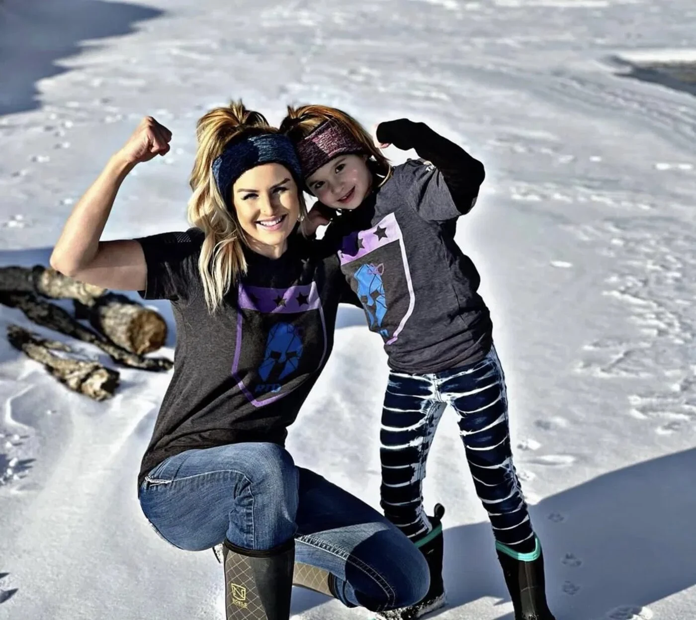 A mother and daughter wearing Raising Tactical Daughters shirts